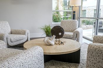 social lounge with conversation areas at The Allure apartments